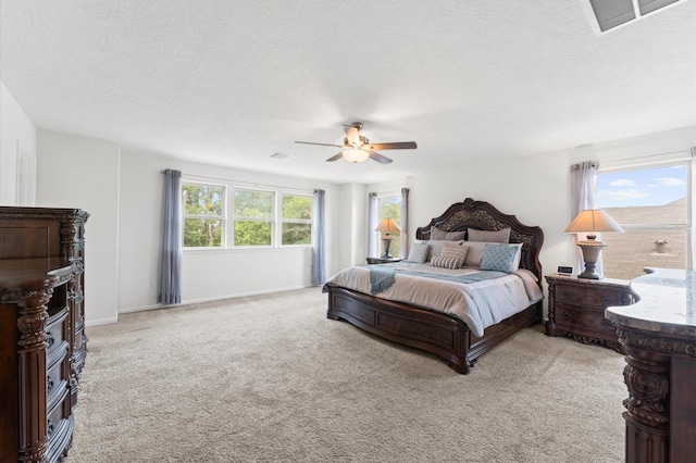 1164 Clonmore Ct, Conroe, TX 77304 - bedroom with light carpet, a textured ceiling, a ceiling fan, and baseboards
