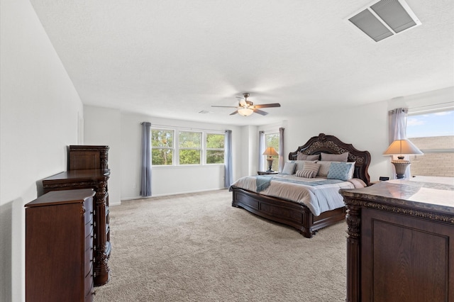 1164 Clonmore Ct, Conroe, TX 77304 - bedroom featuring light colored carpet, a ceiling fan, and a textured ceiling