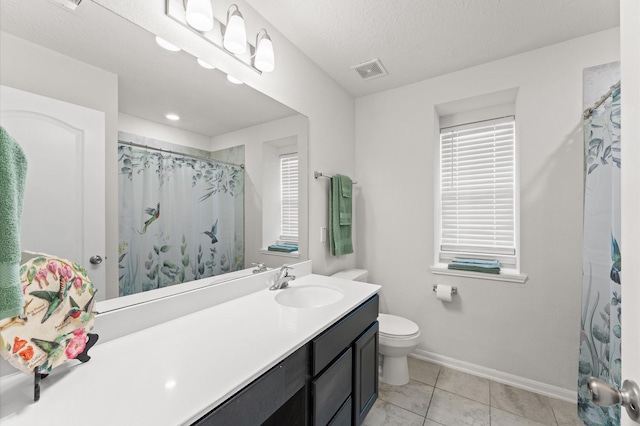 1164 Clonmore Ct, Conroe, TX 77304 - full bathroom featuring toilet, vanity, baseboards, tile patterned flooring, and a shower with shower curtain