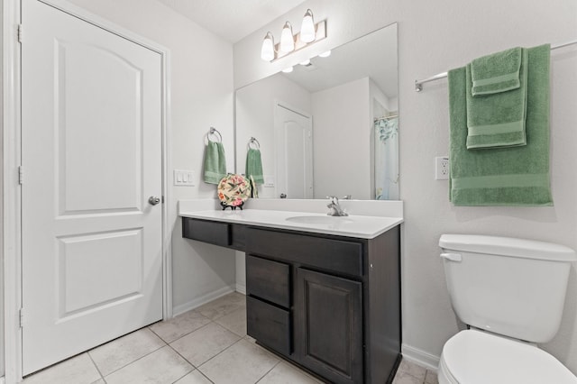 1164 Clonmore Ct, Conroe, TX 77304 - bathroom featuring toilet, vanity, tile patterned floors, and baseboards