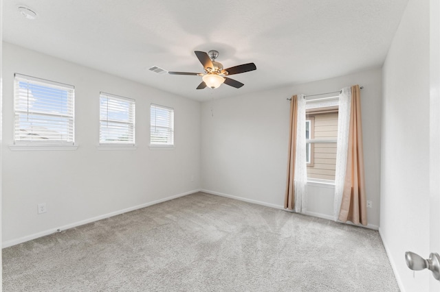 1164 Clonmore Ct, Conroe, TX 77304 - carpeted spare room with ceiling fan, baseboards, and a smoke detector