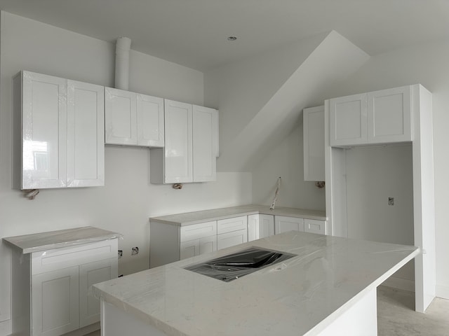 1934 Wildpacher Ln, Houston, TX 77080 - kitchen featuring a center island, white cabinets, and stovetop