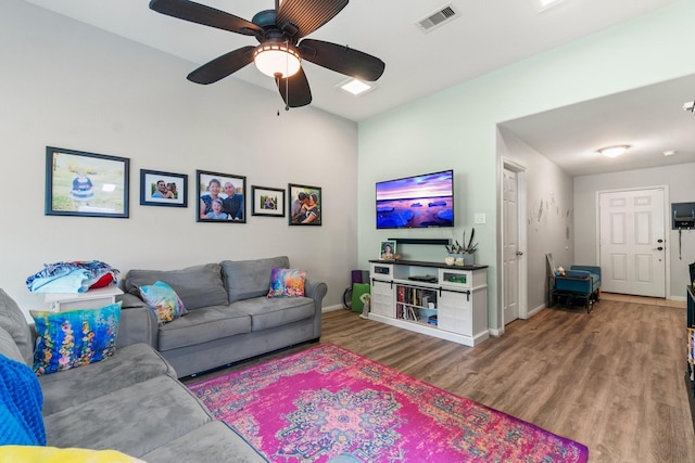 12218 Estelle Ln, Pinehurst, TX 77362 - living area featuring wood finished floors, baseboards, and ceiling fan