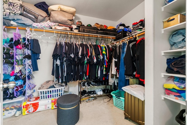 12218 Estelle Ln, Pinehurst, TX 77362 - walk in closet featuring carpet