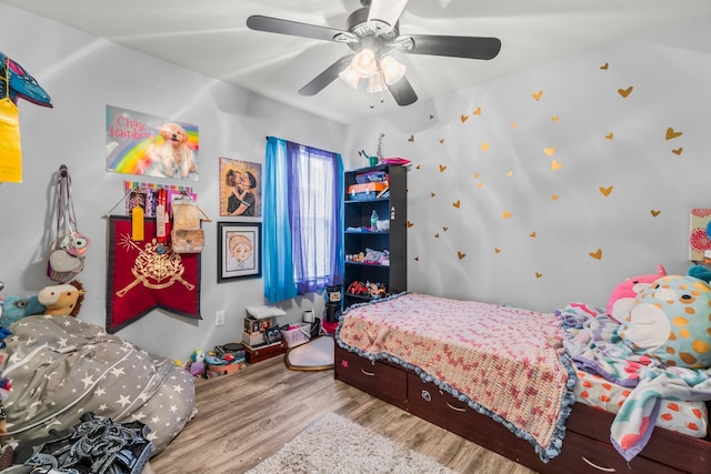 12218 Estelle Ln, Pinehurst, TX 77362 - bedroom with wood finished floors and ceiling fan
