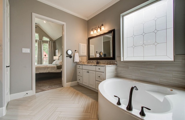 31297 New Forest Park Ln, Spring, TX 77386 - bathroom featuring vanity, a garden tub, lofted ceiling, connected bathroom, and ornamental molding