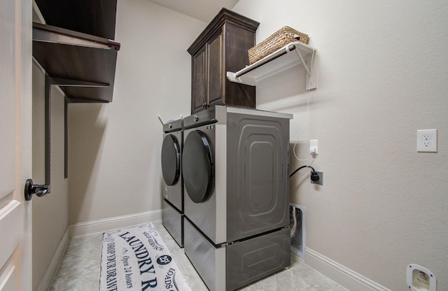 31297 New Forest Park Ln, Spring, TX 77386 - washroom featuring washing machine and dryer, cabinet space, and light tile patterned floors