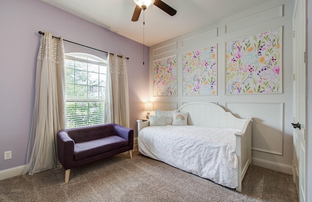 31297 New Forest Park Ln, Spring, TX 77386 - carpeted bedroom featuring a ceiling fan and a decorative wall