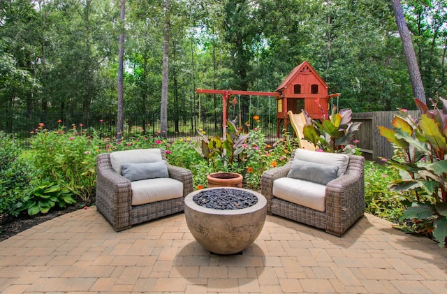 31297 New Forest Park Ln, Spring, TX 77386 - fenced backyard with a patio and a playground