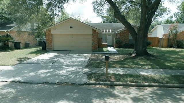 1419 Valley Landing Dr, Katy, TX 77450 - single story home featuring an attached garage, brick siding, and driveway