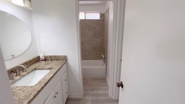 1419 Valley Landing Dr, Katy, TX 77450 - bathroom featuring vanity, shower / tub combination, wood finished floors, and baseboards