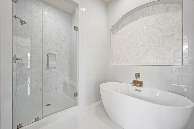 825 W 16th St Unit A, Houston, TX 77008 - full bathroom with tile walls, a shower stall, and a soaking tub