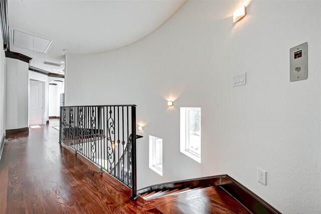 825 W 16th St Unit A, Houston, TX 77008 - hall featuring attic access, an upstairs landing, wood finished floors, and baseboards