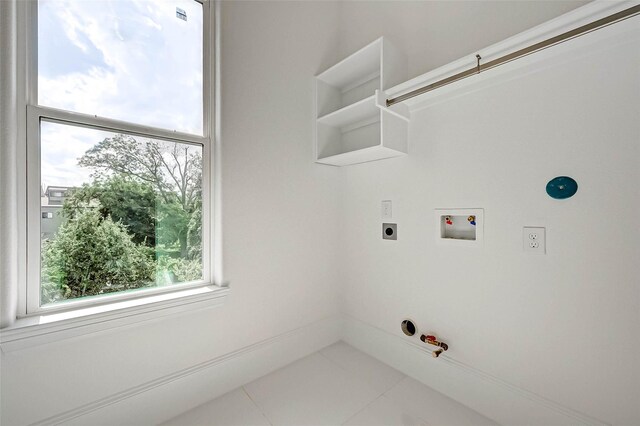 825 W 16th St Unit A, Houston, TX 77008 - laundry area with gas dryer hookup, washer hookup, tile patterned floors, and electric dryer hookup