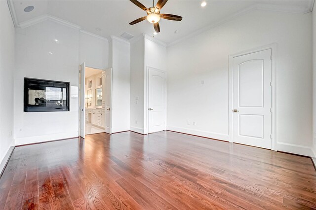 825 W 16th St Unit A, Houston, TX 77008 - unfurnished living room with ceiling fan, crown molding, wood finished floors, high vaulted ceiling, and baseboards