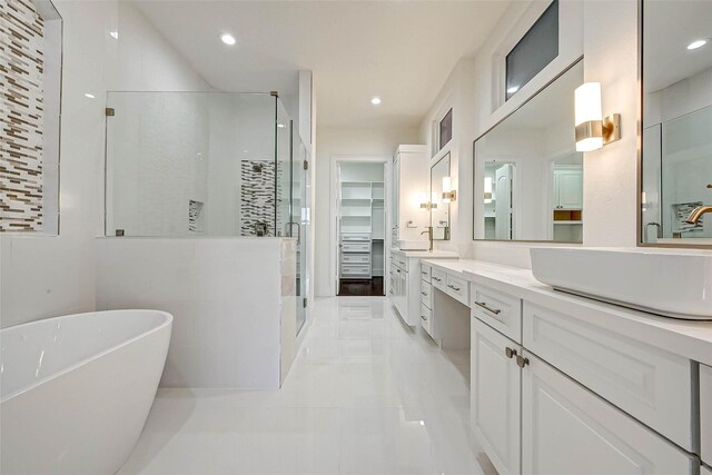 825 W 16th St Unit A, Houston, TX 77008 - full bathroom featuring a shower stall, vanity, a spacious closet, a freestanding tub, and tile patterned floors