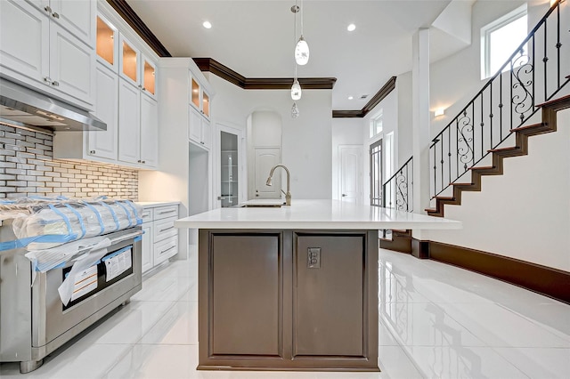 825 W 16th St Unit A, Houston, TX 77008 - kitchen with a sink, light countertops, decorative backsplash, range, and white cabinetry