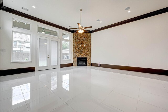 825 W 16th St Unit A, Houston, TX 77008 - unfurnished living room with crown molding, tile patterned floors, ceiling fan, a fireplace, and recessed lighting