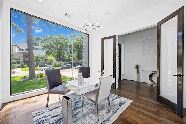 2310 Althea Dr, Houston, TX 77018 - dining area featuring a chandelier, dark wood finished floors, and an office area
