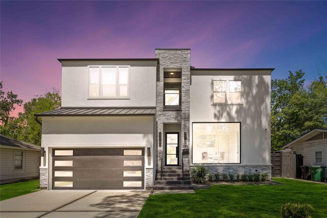 2310 Althea Dr, Houston, TX 77018 - modern home with a standing seam roof, stone siding, a garage, and concrete driveway