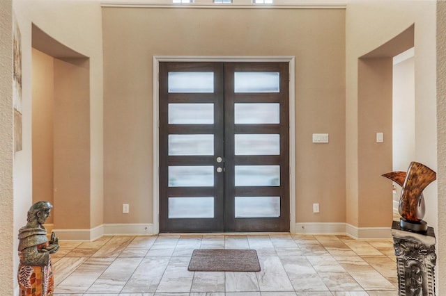 1010 Zoyas Creek Trl, Katy, TX 77494 - foyer with light marble finish flooring, french doors, and healthy amount of natural light