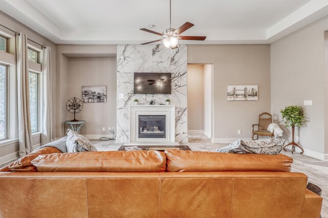 1010 Zoyas Creek Trl, Katy, TX 77494 - living room with a ceiling fan, a fireplace, and baseboards