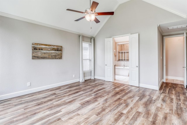 1010 Zoyas Creek Trl, Katy, TX 77494 - unfurnished bedroom with lofted ceiling, wood finished floors, ensuite bathroom, and baseboards