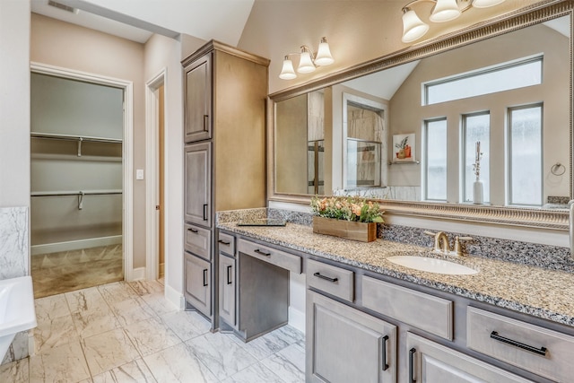 1010 Zoyas Creek Trl, Katy, TX 77494 - full bathroom featuring marble finish floors, vanity, vaulted ceiling, an enclosed shower, and a spacious closet