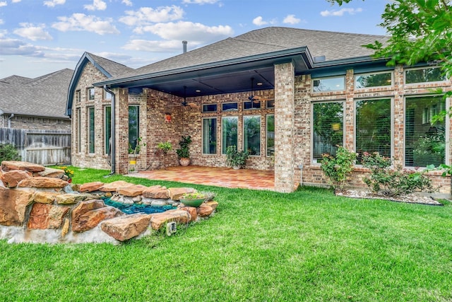 1010 Zoyas Creek Trl, Katy, TX 77494 - rear view of property with a patio area, brick siding, and roof with shingles