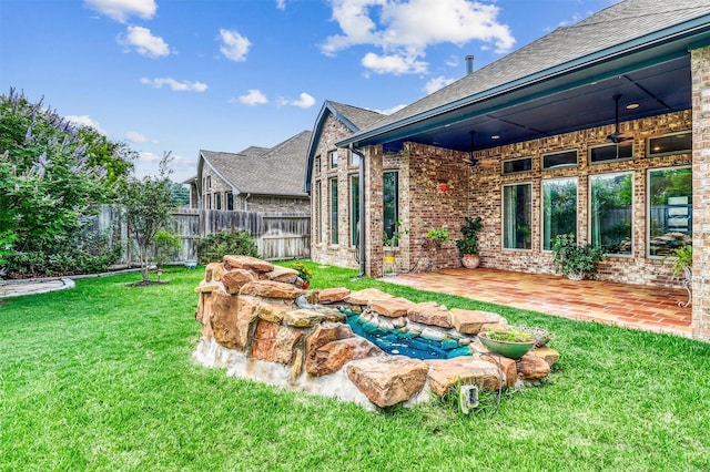 1010 Zoyas Creek Trl, Katy, TX 77494 - view of yard featuring a patio area and a ceiling fan