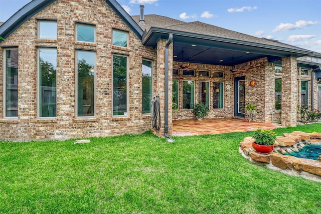 1010 Zoyas Creek Trl, Katy, TX 77494 - rear view of property with a patio area, brick siding, and a yard