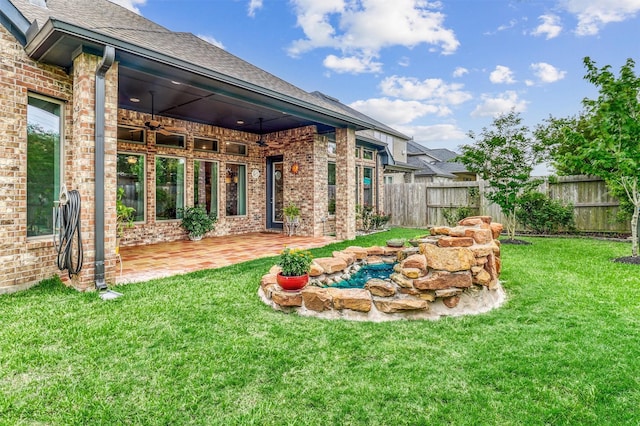 1010 Zoyas Creek Trl, Katy, TX 77494 - view of yard with a ceiling fan and a patio area