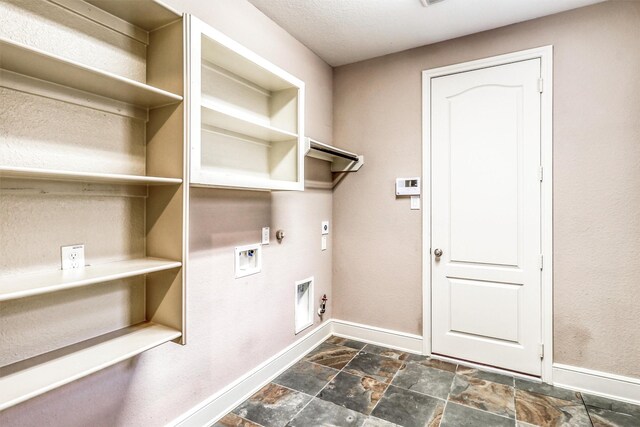 1010 Zoyas Creek Trl, Katy, TX 77494 - washroom with gas dryer hookup, electric dryer hookup, baseboards, and dark stone finish flooring