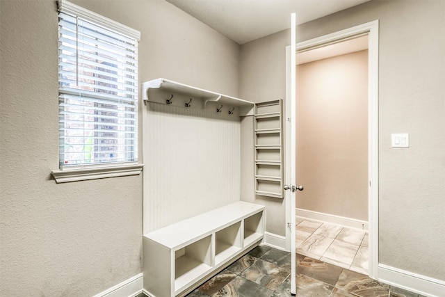 1010 Zoyas Creek Trl, Katy, TX 77494 - mudroom with marble look tile flooring and baseboards