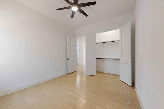 117 Keaau Ct, Bastrop, TX 78602 - unfurnished bedroom featuring baseboards, a closet, and light wood-type flooring