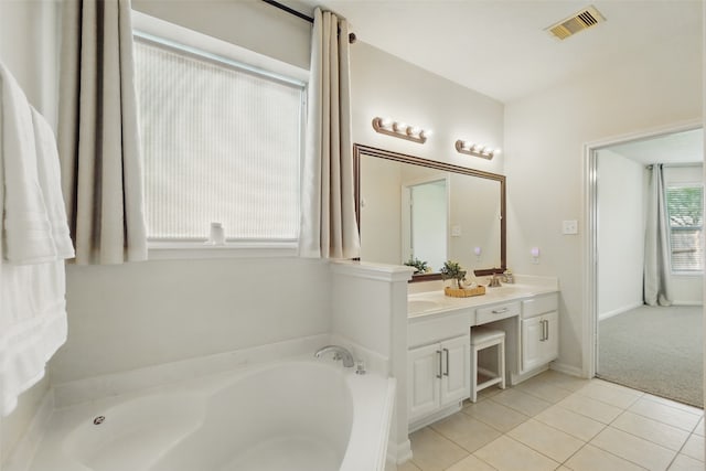 9034 Cedar Run Fls, Tomball, TX 77375 - bathroom featuring tile patterned flooring, a bath, and double vanity