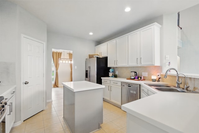 9034 Cedar Run Fls, Tomball, TX 77375 - kitchen with appliances with stainless steel finishes, a sink, a kitchen island, white cabinetry, and light tile patterned floors