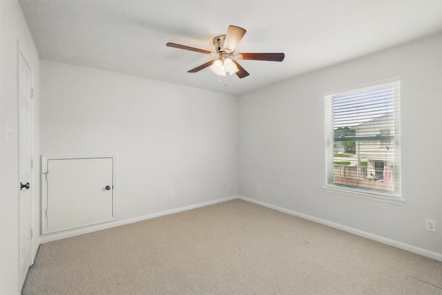 9034 Cedar Run Fls, Tomball, TX 77375 - empty room with light carpet, a ceiling fan, and baseboards