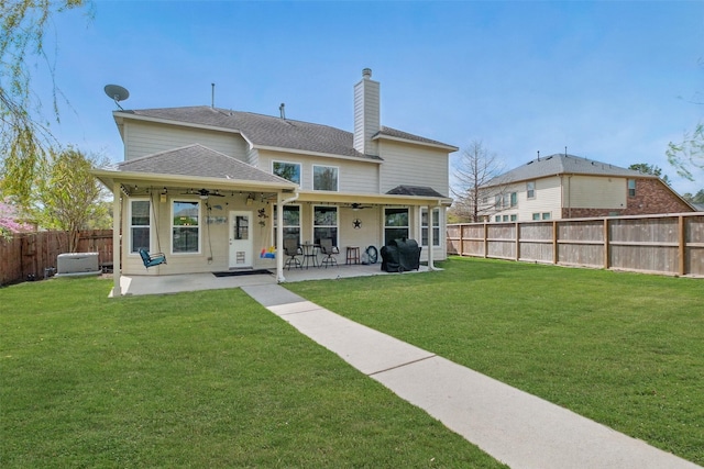 9034 Cedar Run Fls, Tomball, TX 77375 - back of house featuring a ceiling fan, a patio, a shingled roof, and a chimney