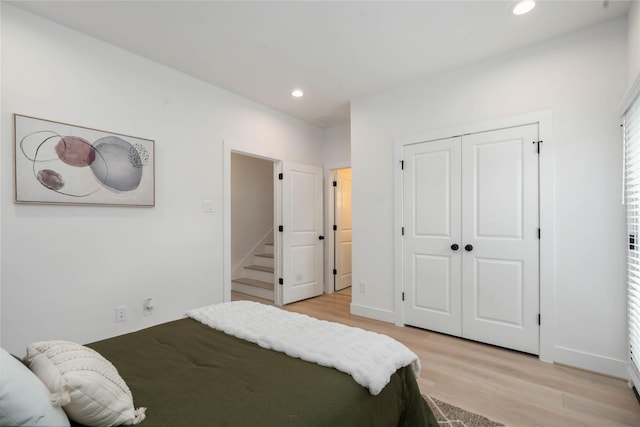 2520 Live Oak St, Houston, TX 77004 - bedroom with light wood finished floors, recessed lighting, and a closet