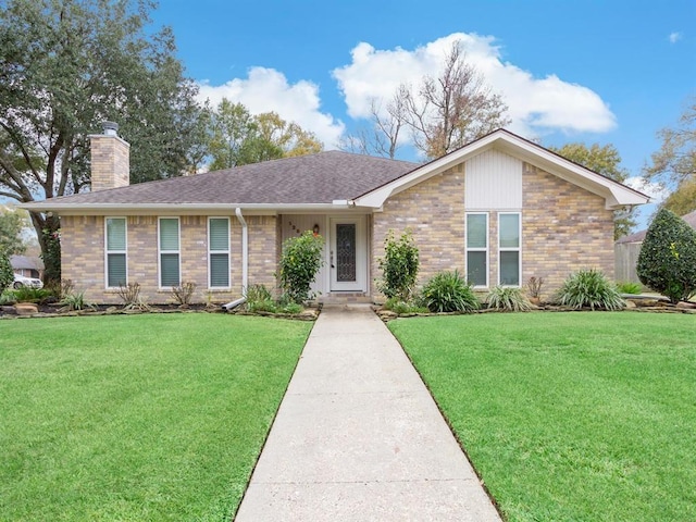 12955 Mintwood Dr, Beaumont, TX 77713 - single story home with a chimney, a front lawn, and brick siding