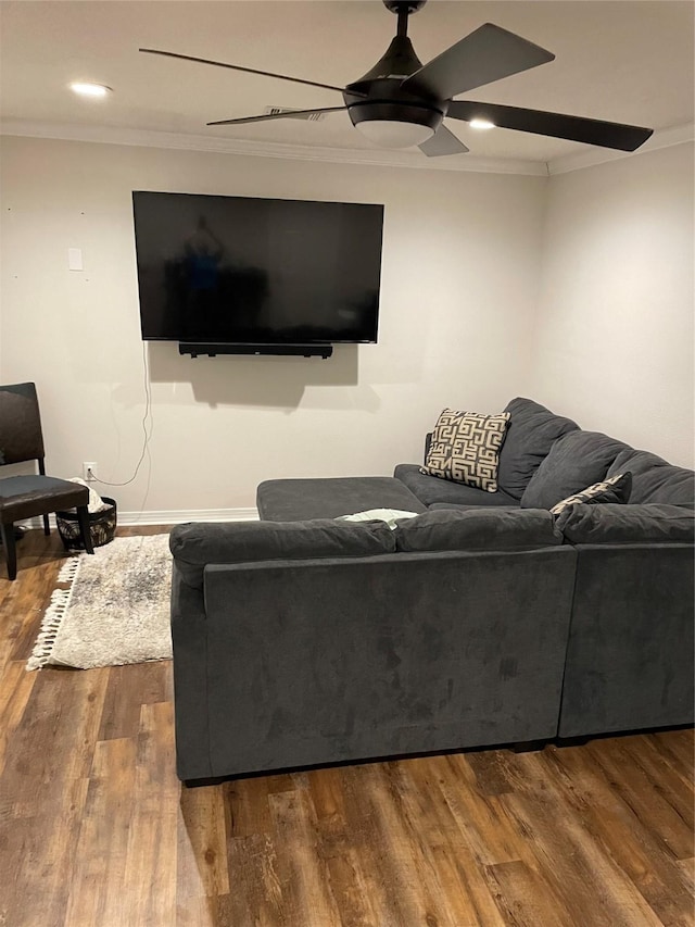 12955 Mintwood Dr, Beaumont, TX 77713 - living room featuring a ceiling fan, dark wood-style flooring, crown molding, baseboards, and recessed lighting
