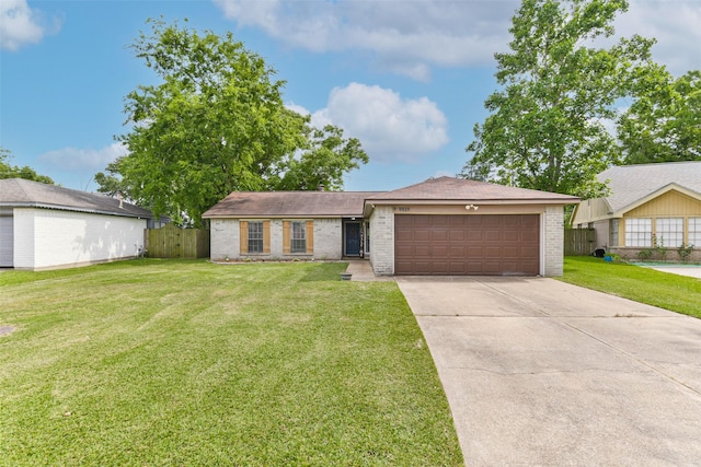 9819 Orangevale Dr, Spring, TX 77379 - ranch-style house featuring brick siding, concrete driveway, a garage, and roof with shingles