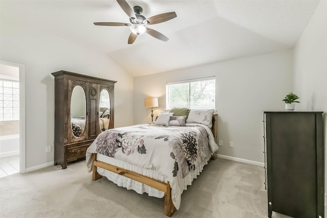 9819 Orangevale Dr, Spring, TX 77379 - bedroom featuring multiple windows, vaulted ceiling, light colored carpet, and baseboards