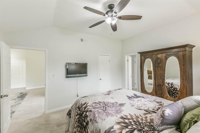 9819 Orangevale Dr, Spring, TX 77379 - bedroom with light carpet, lofted ceiling, a ceiling fan, and baseboards