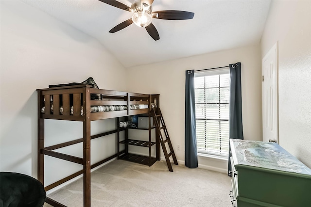 9819 Orangevale Dr, Spring, TX 77379 - bedroom with light colored carpet, vaulted ceiling, baseboards, and a ceiling fan