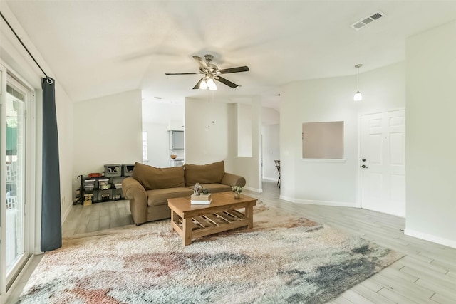 9819 Orangevale Dr, Spring, TX 77379 - living area featuring healthy amount of natural light, ceiling fan, wood finished floors, baseboards, and vaulted ceiling