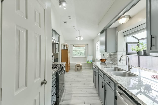 9819 Orangevale Dr, Spring, TX 77379 - kitchen featuring a sink, stainless steel appliances, tasteful backsplash, and gray cabinets