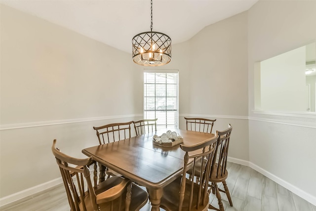 9819 Orangevale Dr, Spring, TX 77379 - dining room with a chandelier, baseboards, vaulted ceiling, and light wood-style floors