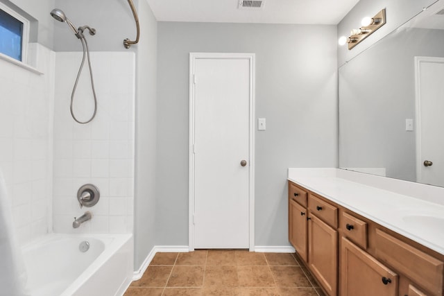 8907 Wildbird Ln, Humble, TX 77338 - full bathroom with vanity, shower / bath combination, baseboards, and tile patterned floors